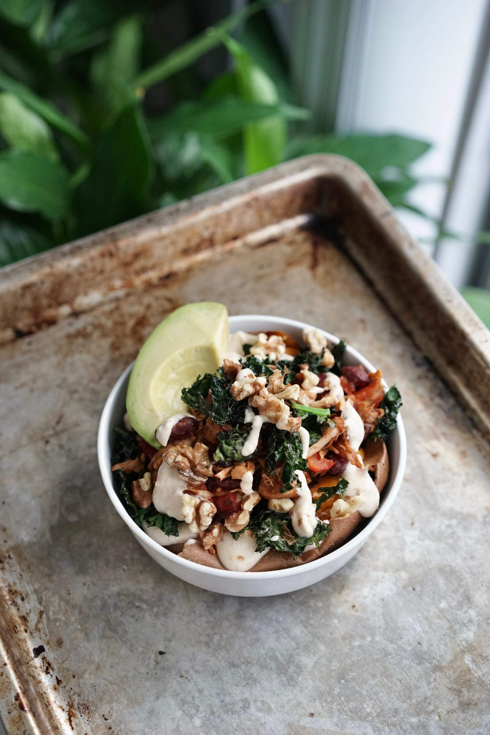 Baked Sweet Potato with BBQ Jackfruit, Crispy Kale & Tahini Sauce | Living Healthy in Seattle